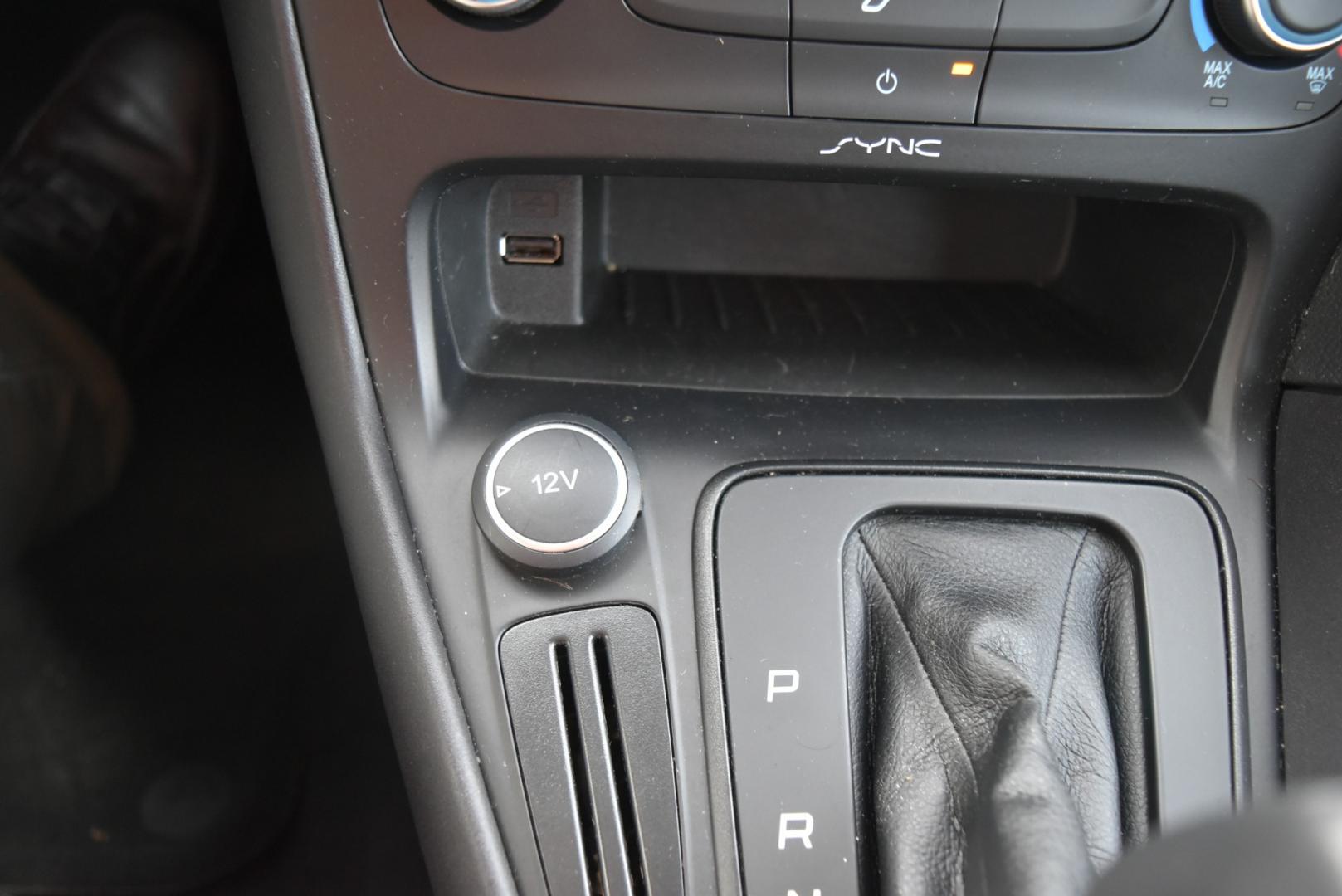 2016 Gray /Black Ford Focus SE (1FADP3F26GL) with an 2.0L I-4 GDI TI-VCT FLEX FUEL engine, 6-Speed Powershift Automatic transmission, located at 1600 E Hwy 44, Rapid City, SD, 57703, (605) 716-7878, 44.070232, -103.171410 - Photo#21